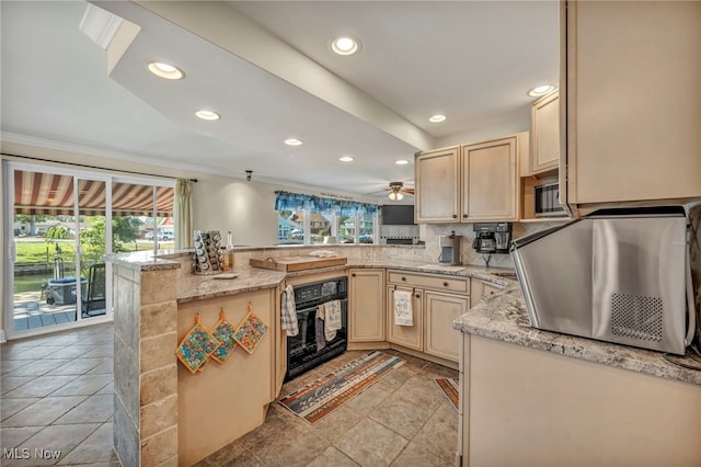 1909 N Nan Ave, Lakeside-Marblehead, OH 43440 - kitchen with oven, a peninsula, light brown cabinetry, recessed lighting, and ceiling fan