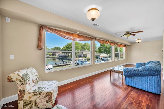 1909 N Nan Ave, Lakeside-Marblehead, OH 43440 - living area with wood finished floors, baseboards, and ceiling fan