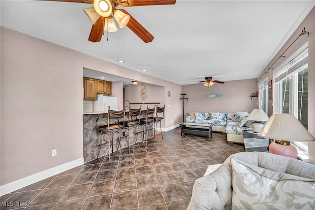 1909 N Nan Ave, Lakeside-Marblehead, OH 43440 - tiled living area with a ceiling fan and baseboards