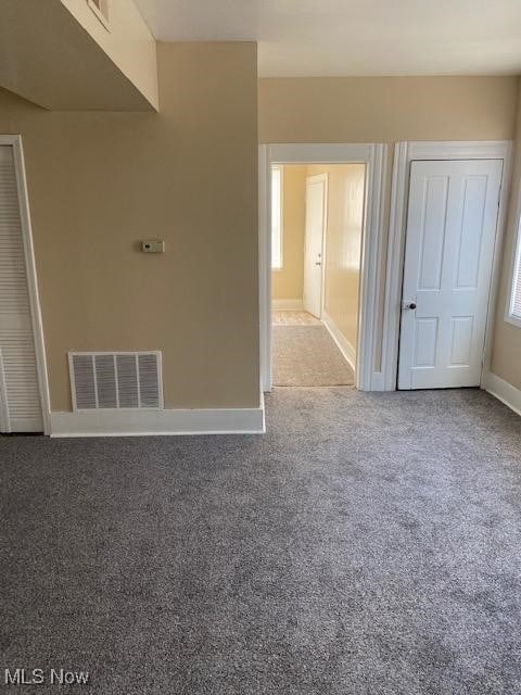 spare room featuring carpet floors