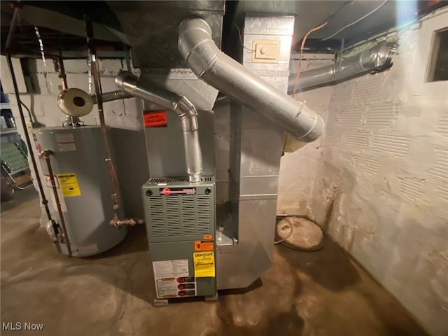 utility room with gas water heater