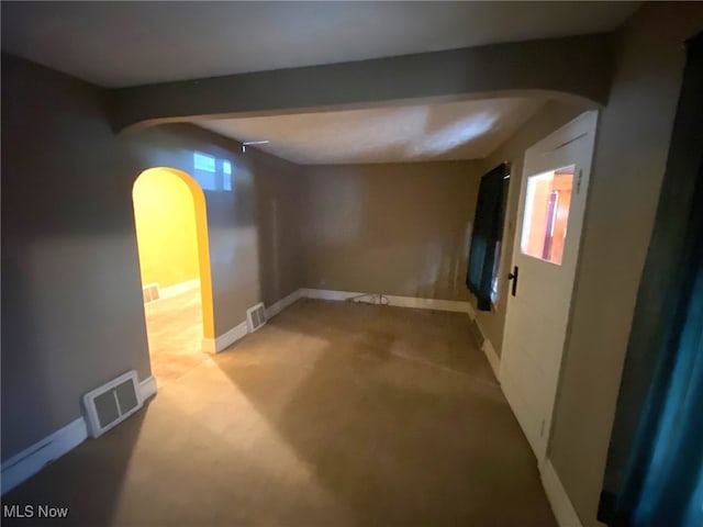 empty room with light colored carpet