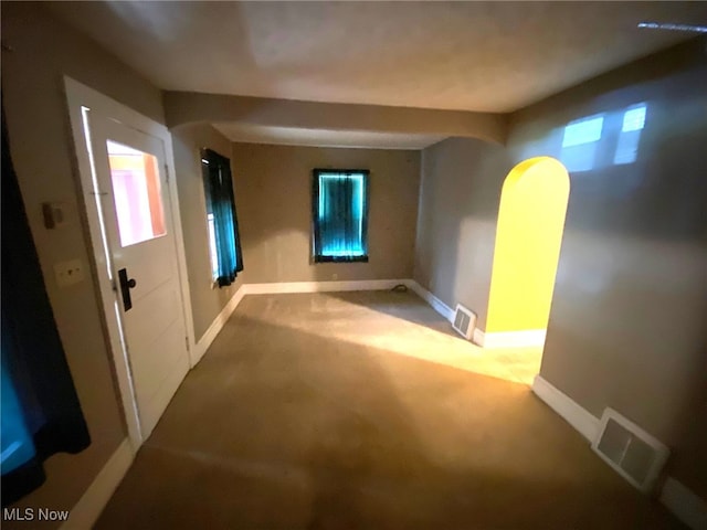 unfurnished room featuring carpet flooring