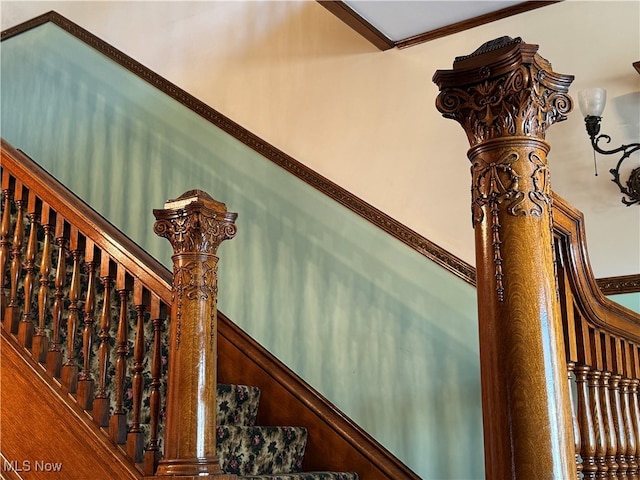 staircase featuring ornamental molding