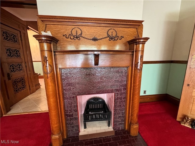 room details with a fireplace and carpet flooring