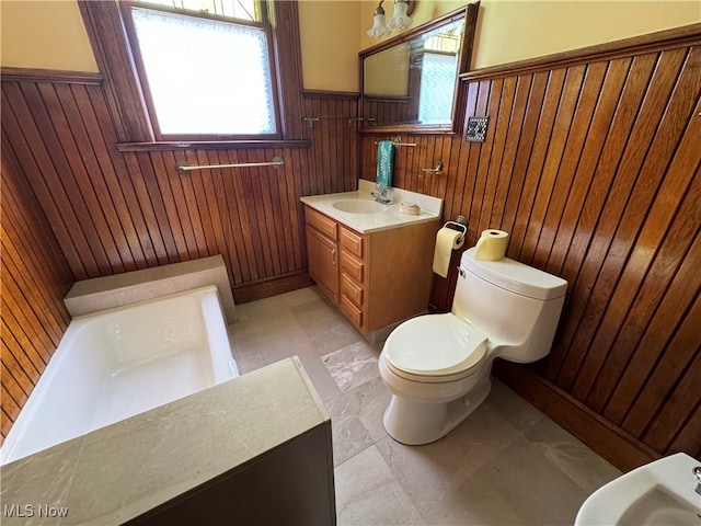 bathroom featuring wood walls, a bidet, vanity, and toilet