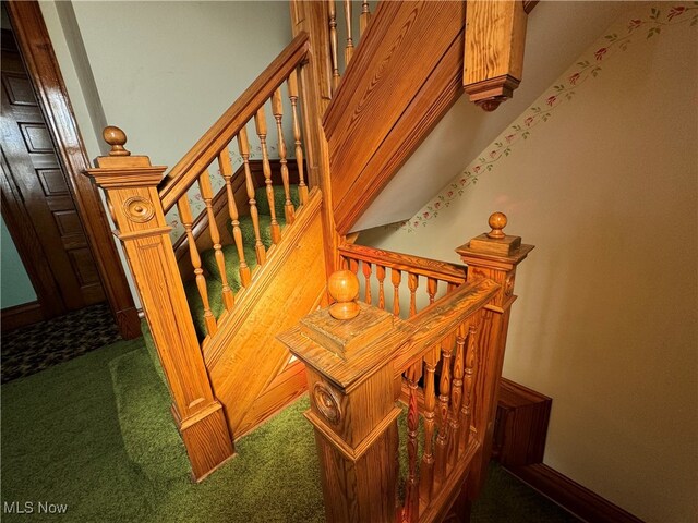 stairs featuring carpet floors