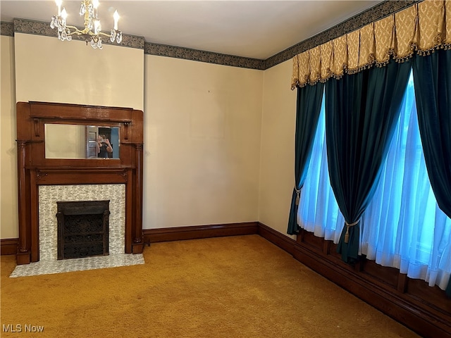 unfurnished living room with light colored carpet and a chandelier