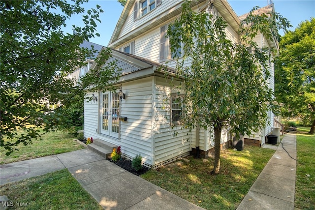 view of home's exterior featuring a lawn