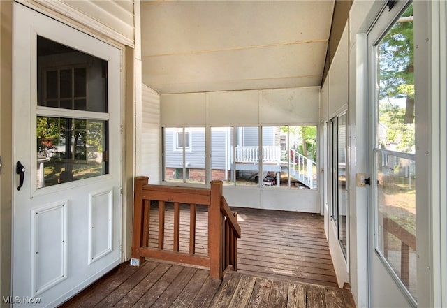 sunroom featuring vaulted ceiling