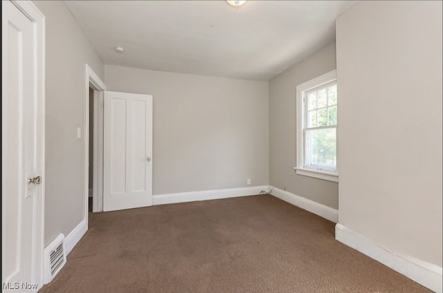 view of carpeted spare room