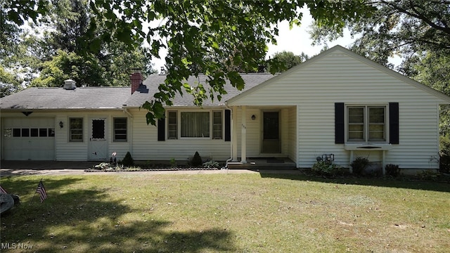 ranch-style home with a garage and a front yard