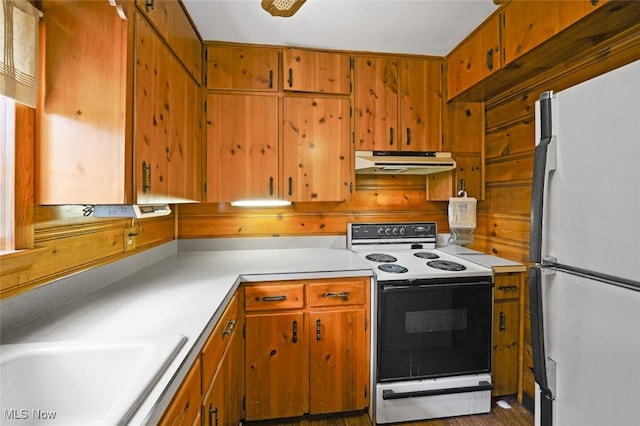 kitchen featuring sink and white appliances