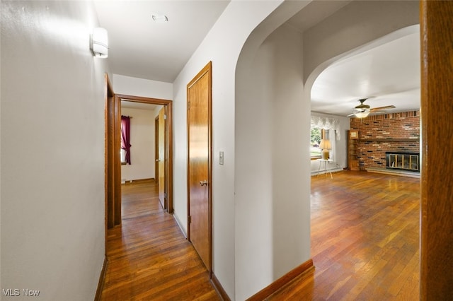 hall with dark hardwood / wood-style flooring