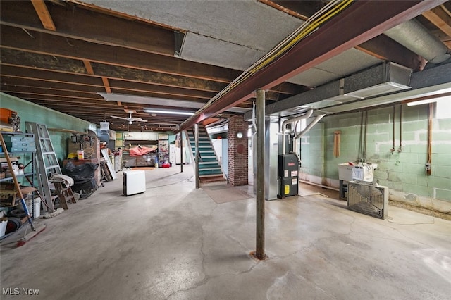 basement featuring heating unit and sink