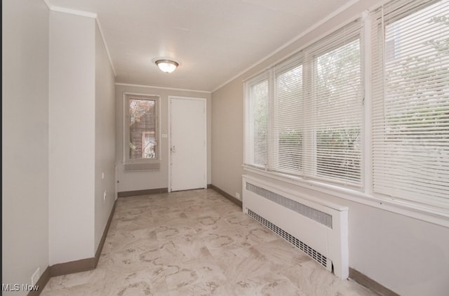 doorway to outside with crown molding and radiator