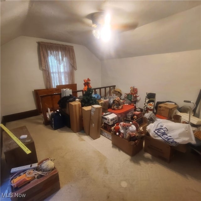 additional living space featuring light colored carpet and vaulted ceiling