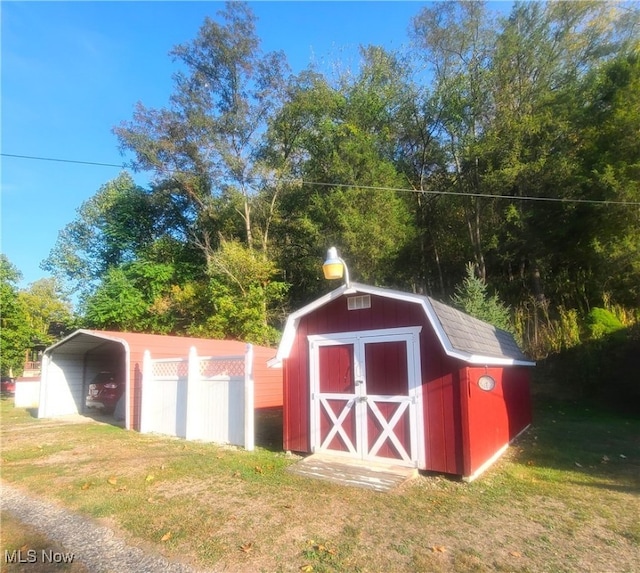 view of outbuilding with a lawn