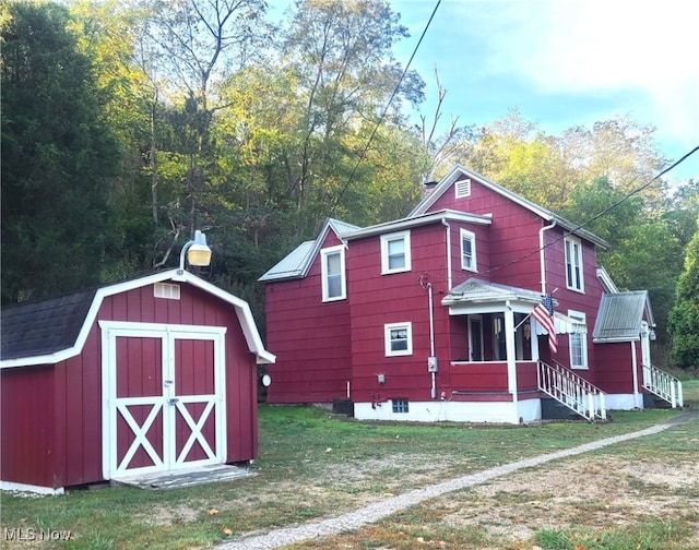 view of outdoor structure featuring a lawn