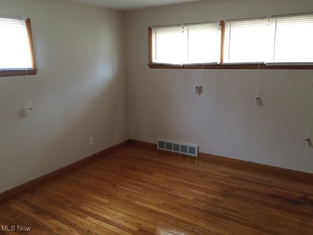 empty room featuring wood-type flooring