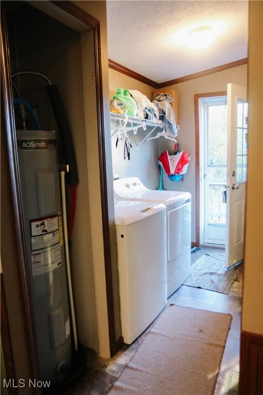 clothes washing area featuring a textured ceiling, light hardwood / wood-style flooring, ornamental molding, water heater, and washer and clothes dryer