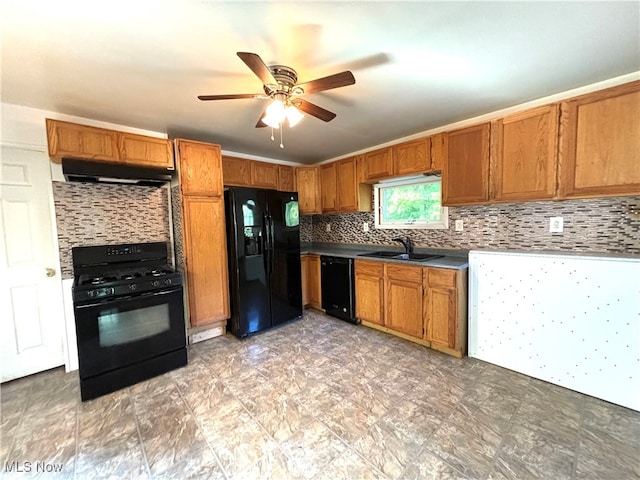 kitchen with tasteful backsplash, range hood, black appliances, sink, and ceiling fan