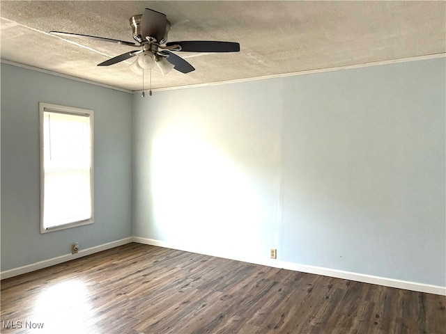 spare room featuring ceiling fan, a textured ceiling, wood-type flooring, and ornamental molding