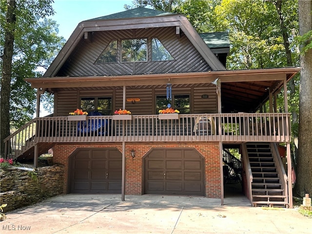 log home featuring a garage