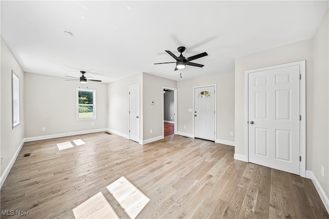 interior space with ceiling fan and light hardwood / wood-style flooring