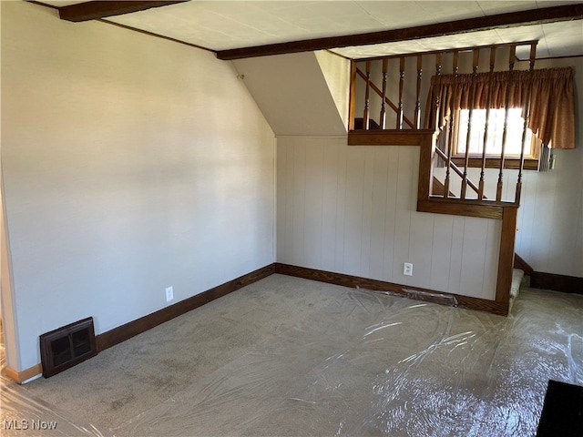 interior space featuring beamed ceiling