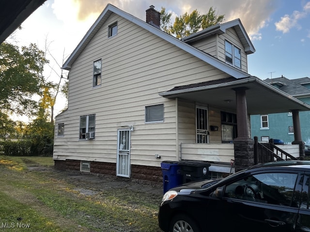 view of home's exterior featuring covered porch