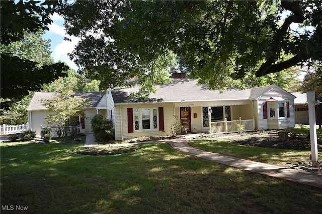 ranch-style home with a front yard and a porch