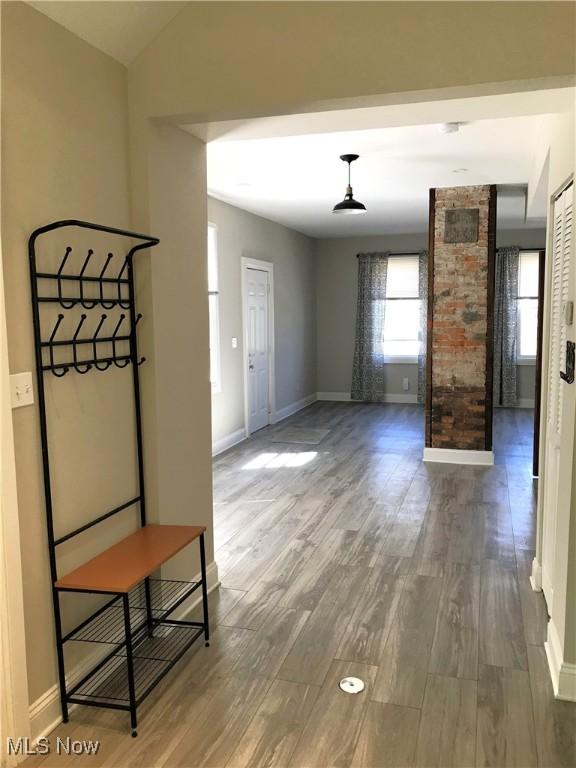 unfurnished living room featuring hardwood / wood-style flooring