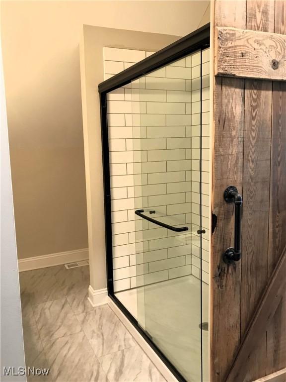 bathroom featuring walk in shower