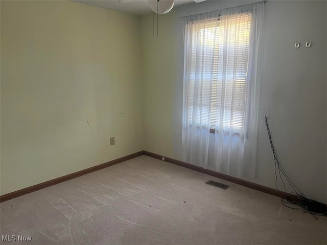 unfurnished room with ceiling fan and carpet floors