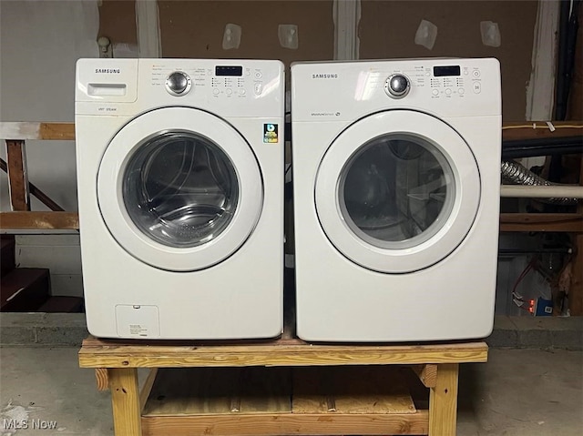 clothes washing area with independent washer and dryer