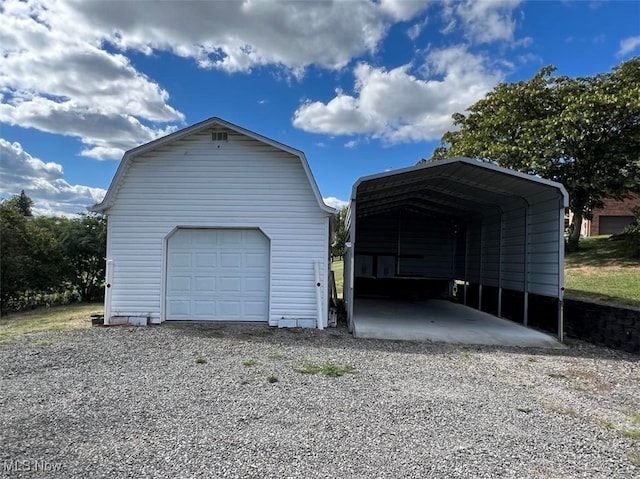 garage featuring a carport