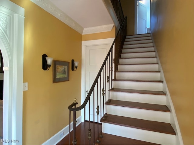 stairs featuring ornamental molding