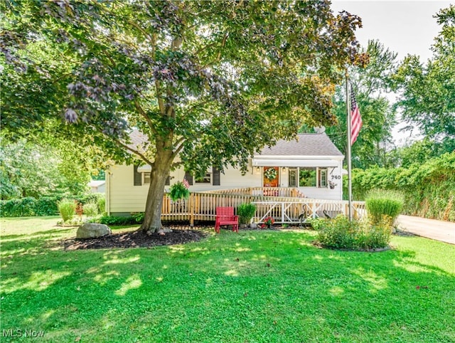 view of front of property with a front lawn and a deck