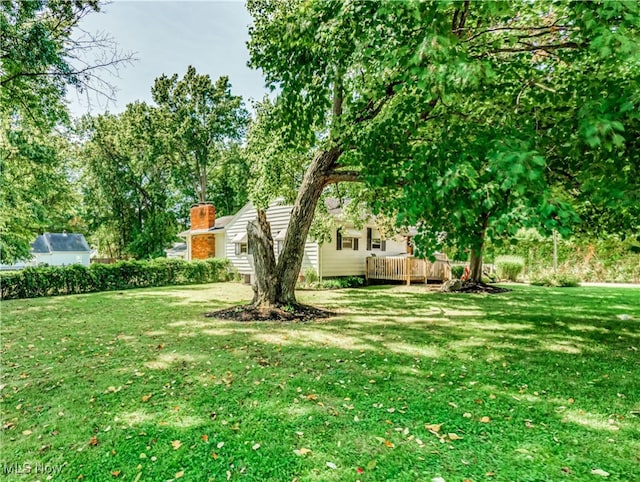 view of yard with a deck