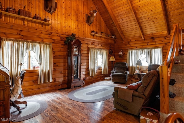 living room featuring high vaulted ceiling, hardwood / wood-style flooring, wooden ceiling, and beam ceiling