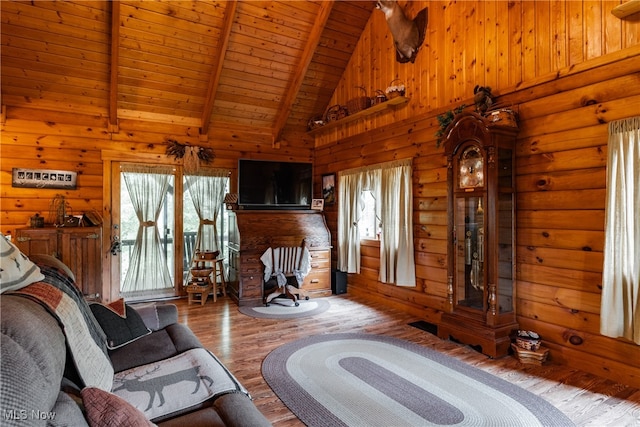 living room with beamed ceiling, high vaulted ceiling, wooden walls, wood-type flooring, and wooden ceiling