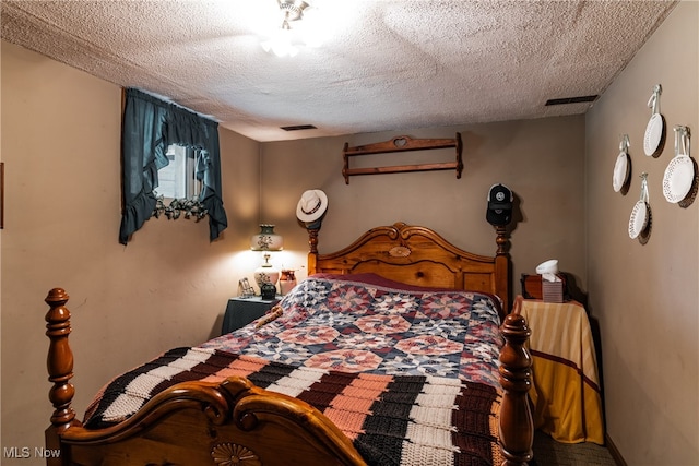 bedroom featuring a textured ceiling