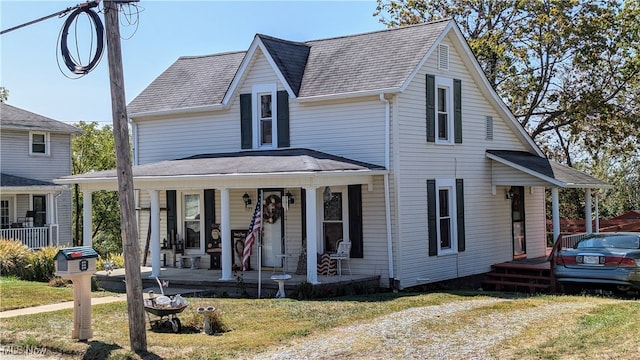 view of front of home with a front lawn and a porch