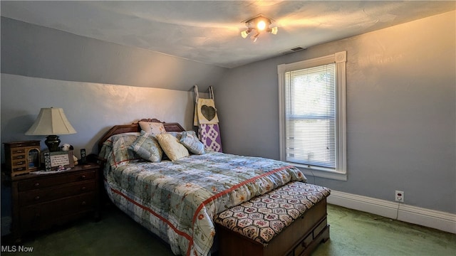 carpeted bedroom featuring vaulted ceiling