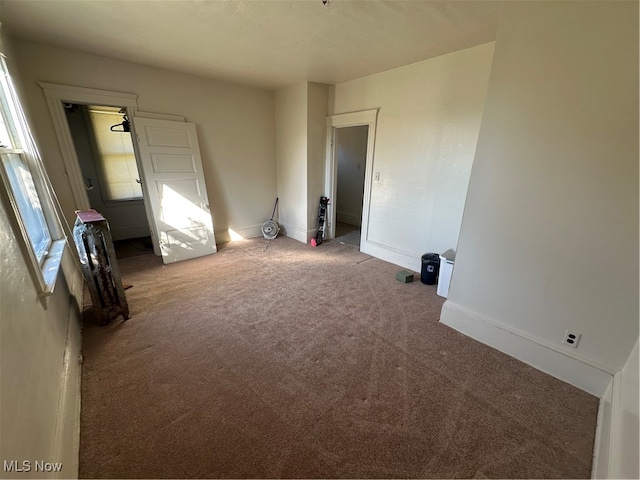 unfurnished room with carpet flooring