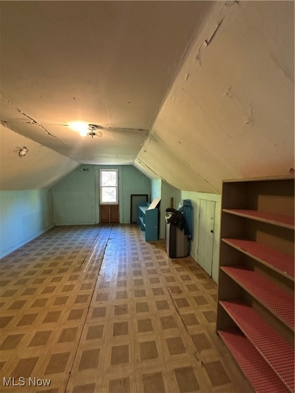 bonus room featuring vaulted ceiling