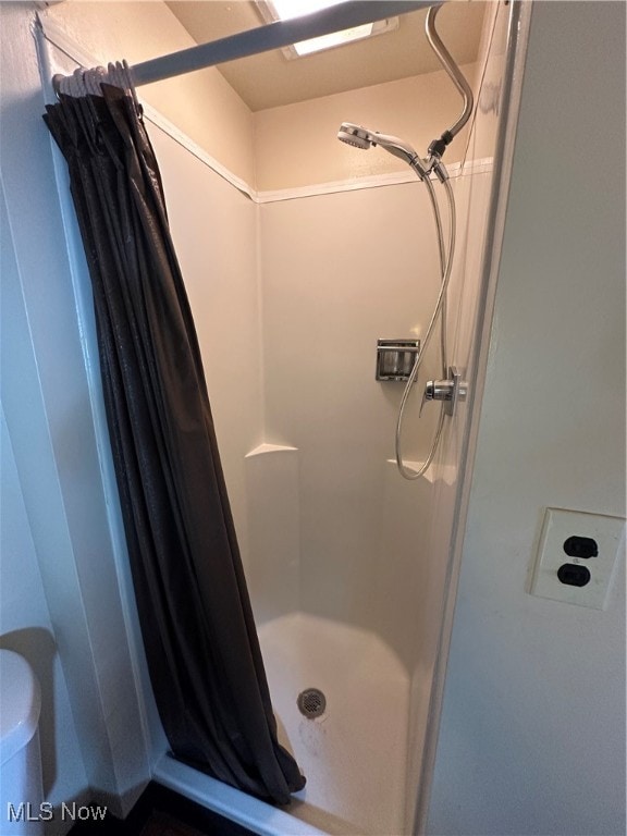 bathroom featuring walk in shower