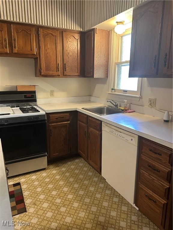 kitchen with sink and white appliances