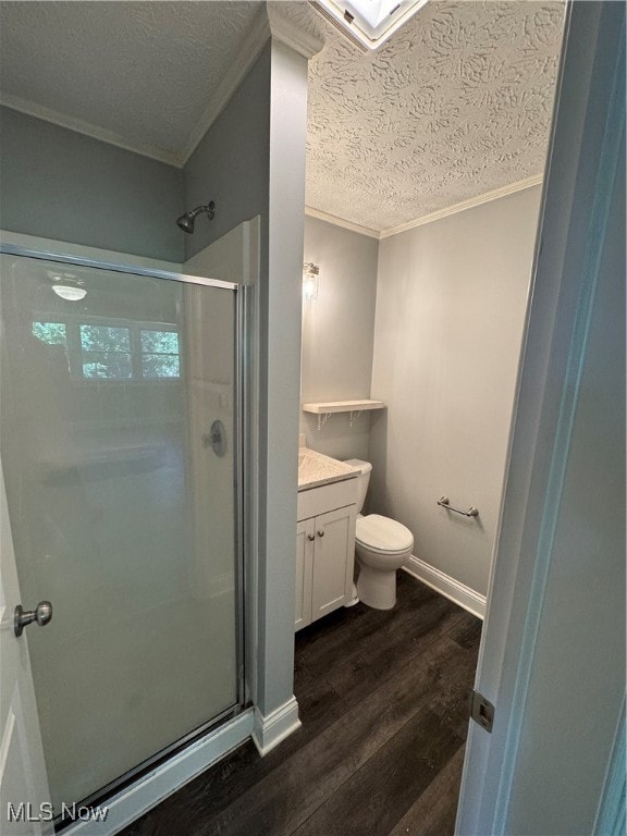 bathroom featuring vanity, toilet, an enclosed shower, and hardwood / wood-style flooring